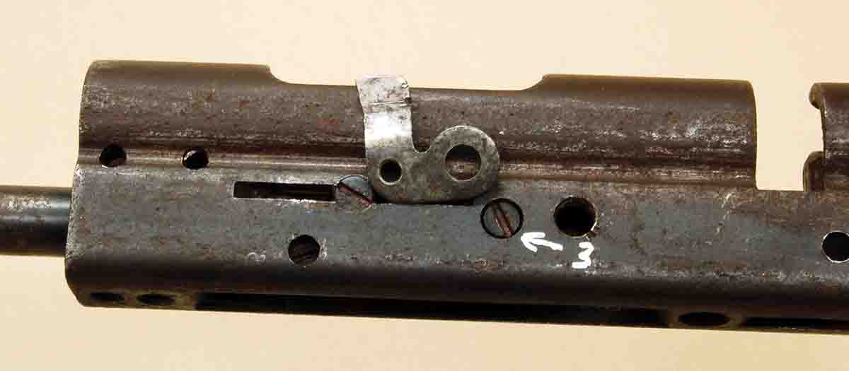 Screw “3” secures the ejector shown here lying next to the screw head.
